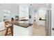 Kitchen area with breakfast bar and stainless-steel appliances at 1521 Southport St, The Villages, FL 32162