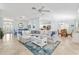 Expansive living area seamlessly connecting the kitchen, dining, and living spaces for modern living at 1521 Southport St, The Villages, FL 32162