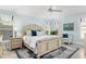Comfortable main bedroom features plantation shutters, a ceiling fan, and stylish furnishings at 1521 Southport St, The Villages, FL 32162