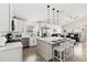 Bright and airy living space with modern decor, comfortable seating, and a view of the pool and waterfront at 157 Julliard Blvd, Davenport, FL 33897
