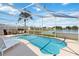 Enjoy this screened-in pool with a great view of the water and landscape at 157 Julliard Blvd, Davenport, FL 33897
