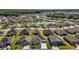 Aerial view of home showcasing serene lake view and neighborhood at 1627 Mclucas Ln, The Villages, FL 34762