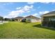 Backyard showcasing a lush lawn at 1627 Mclucas Ln, The Villages, FL 34762