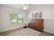 Bright bedroom with a ceiling fan, ample natural light and neutral decor at 1627 Mclucas Ln, The Villages, FL 34762