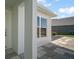 Home's entryway featuring modern stonework and exterior architectural details at 1627 Mclucas Ln, The Villages, FL 34762