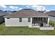View of screened-in lanai and backyard at 1627 Mclucas Ln, The Villages, FL 34762