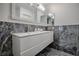 Modern bathroom with double vanity, sleek fixtures, and stylish marble accents at 17009 Se 96Th Chapelwood Cir, The Villages, FL 32162