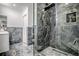 Modern bathroom featuring glass enclosed shower with built-in niche and sleek fixtures at 17009 Se 96Th Chapelwood Cir, The Villages, FL 32162
