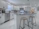 Modern kitchen featuring stainless steel appliances and a granite-topped island at 17009 Se 96Th Chapelwood Cir, The Villages, FL 32162