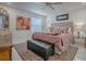 Serene bedroom with a plush bed, stylish decor, and ample natural light at 17009 Se 96Th Chapelwood Cir, The Villages, FL 32162