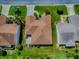An aerial view shows the home's layout and landscaping within a red boundary line at 1701 Lakewood Dr, The Villages, FL 32162