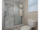 Bathroom showing shower stall, toilet and decorative towel rack at 1701 Lakewood Dr, The Villages, FL 32162