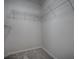 Empty closet with shelving and carpeted floor at 1701 Lakewood Dr, The Villages, FL 32162