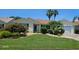 Charming single-story home features a well-manicured lawn, lush landscaping, and inviting curb appeal at 1701 Lakewood Dr, The Villages, FL 32162