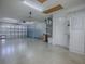 Spacious garage with ample room for parking and storage with side door entry and utility connections at 1701 Lakewood Dr, The Villages, FL 32162