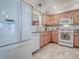 Spacious kitchen with tile floors, modern appliances and countertops making cooking a pleasure in this well-designed space at 1701 Lakewood Dr, The Villages, FL 32162