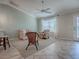 Comfortable living area features tile flooring, a ceiling fan, and stylish seating creating a cozy and inviting space at 1701 Lakewood Dr, The Villages, FL 32162