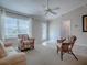 Cozy living room with ample natural light, neutral decor, and comfortable seating, creating a relaxing atmosphere at 1701 Lakewood Dr, The Villages, FL 32162