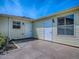 Private patio with direct access from multiple doors with security shutters for added peace of mind at 1701 Lakewood Dr, The Villages, FL 32162
