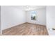 Bright bedroom features hardwood flooring, neutral paint and a window providing ample natural light at 17068 Se 96Th Chapelwood Cir, The Villages, FL 32162