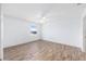 Bright bedroom features hardwood flooring and a window overlooking the backyard at 17068 Se 96Th Chapelwood Cir, The Villages, FL 32162