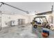 Spacious garage includes storage cabinets, and room to park a golf cart at 17068 Se 96Th Chapelwood Cir, The Villages, FL 32162