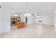 Spacious living area with recessed lighting, ceiling fans, and an open layout to the kitchen at 17068 Se 96Th Chapelwood Cir, The Villages, FL 32162