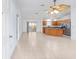 Open floor plan showing the living space, kitchen, and dining area with tile flooring at 17068 Se 96Th Chapelwood Cir, The Villages, FL 32162