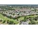 A panoramic view showcases a vibrant community with a golf course at 17108 Se 76Th Creekside Cir, The Villages, FL 32162