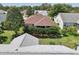 A lovely backyard featuring mature landscaping and a screened-in lanai for relaxing at 17108 Se 76Th Creekside Cir, The Villages, FL 32162