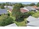 Landscaped backyard showcasing a large tree and well-maintained lawn at 17108 Se 76Th Creekside Cir, The Villages, FL 32162
