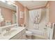 Cozy bathroom featuring bathtub shower combo and a vanity at 17108 Se 76Th Creekside Cir, The Villages, FL 32162