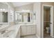 Bathroom has a double sink vanity and separate toilet room at 17108 Se 76Th Creekside Cir, The Villages, FL 32162