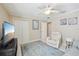Cozy bedroom provides a quiet space with plush recliner at 17108 Se 76Th Creekside Cir, The Villages, FL 32162