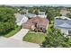 Aerial view of a cozy home surrounded by lush trees and landscaping in a quiet neighborhood at 17108 Se 76Th Creekside Cir, The Villages, FL 32162
