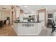 Bright kitchen featuring granite countertops, stainless steel appliances, and white cabinetry at 17108 Se 76Th Creekside Cir, The Villages, FL 32162