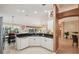 Bright kitchen with granite countertops open to the breakfast nook and main living spaces at 17108 Se 76Th Creekside Cir, The Villages, FL 32162