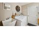 Laundry room features a washer, dryer, sink, and decor at 17108 Se 76Th Creekside Cir, The Villages, FL 32162