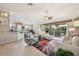 Open living area with comfortable seating, stylish decor, and access to outdoor lanai at 17108 Se 76Th Creekside Cir, The Villages, FL 32162