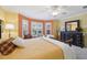 This main bedroom has a bay window and traditional furnishings at 17108 Se 76Th Creekside Cir, The Villages, FL 32162