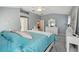 Comfortable main bedroom featuring soft colors, a ceiling fan and adjacent bathroom at 17108 Se 76Th Creekside Cir, The Villages, FL 32162