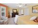 Spacious main bedroom features closet, and accent furniture at 17108 Se 76Th Creekside Cir, The Villages, FL 32162