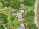 Gorgeous home with a sparkling pool, lush lawn, and mature trees at 1930 Country Club Rd, Eustis, FL 32726