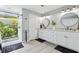 Beautiful bathroom with double vanity, granite countertops, and glass enclosed shower at 1930 Country Club Rd, Eustis, FL 32726