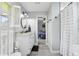 Stylish bathroom with granite countertop and views into main bedroom at 1930 Country Club Rd, Eustis, FL 32726
