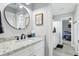 Well-lit bathroom with granite countertop and views into bedroom at 1930 Country Club Rd, Eustis, FL 32726