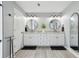 Stylish bathroom featuring double vanity, granite countertops, and modern fixtures at 1930 Country Club Rd, Eustis, FL 32726