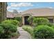 Charming front entrance with stone accents, a covered porch, and manicured landscaping enhancing curb appeal at 1930 Country Club Rd, Eustis, FL 32726
