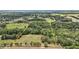 Aerial view of a large, green lot with an approximate boundary in a beautiful, lush, treed area at 19703 Lake Lincoln Ln, Eustis, FL 32736