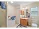 Bright bathroom with single vanity, and walk-in shower, offering a clean and functional space at 19703 Lake Lincoln Ln, Eustis, FL 32736